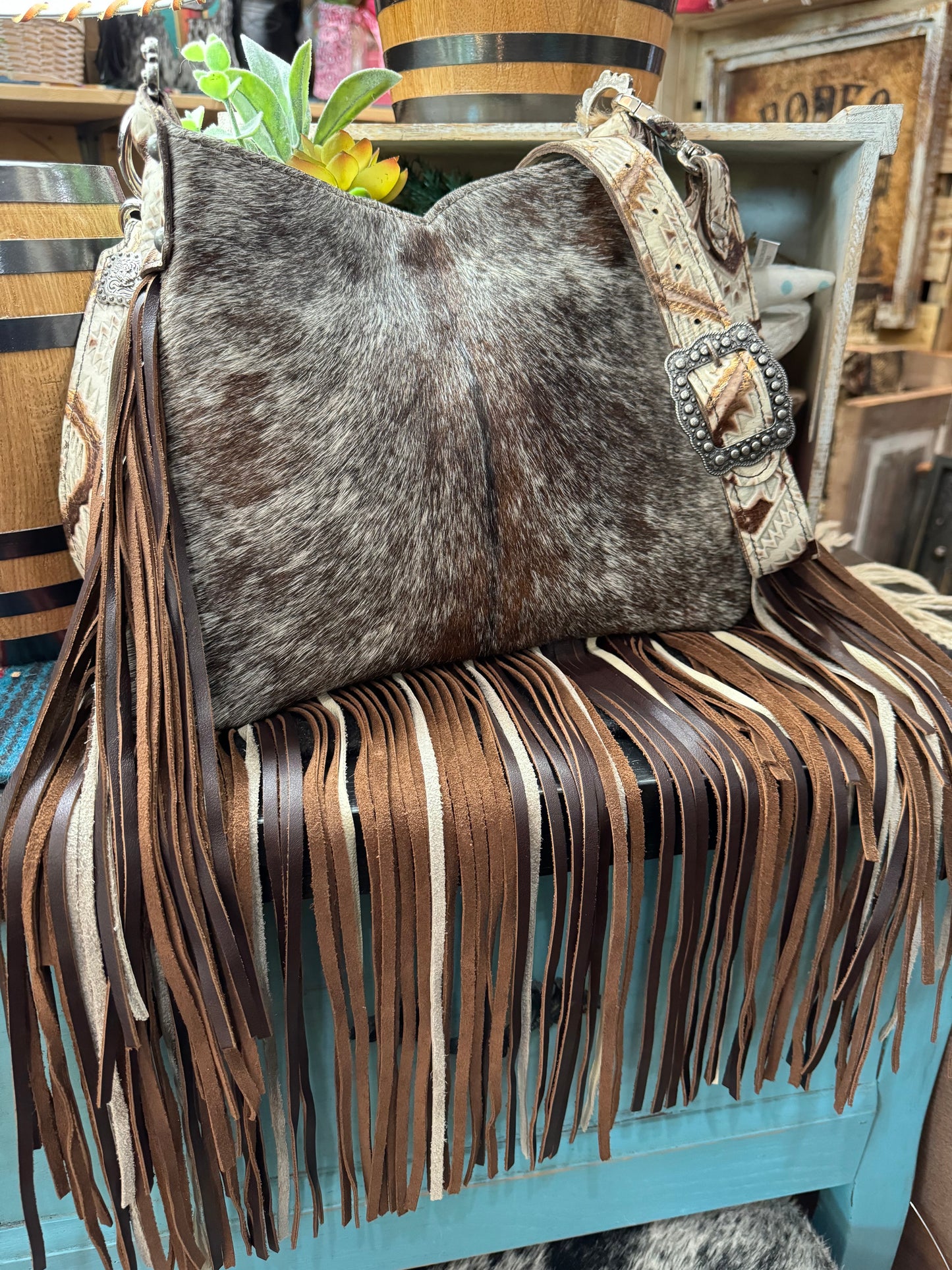 Hobo, Small   brown and white speckled hide with brown bronc