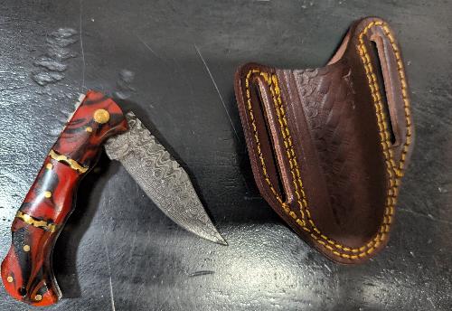 Knife  - Folding pocket style with leather sheath