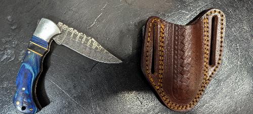 Knife  - Folding pocket style with leather sheath