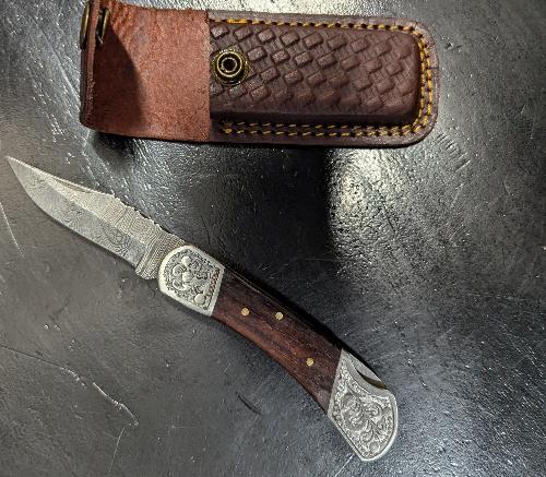 Knife  - Folding pocket style with leather sheath