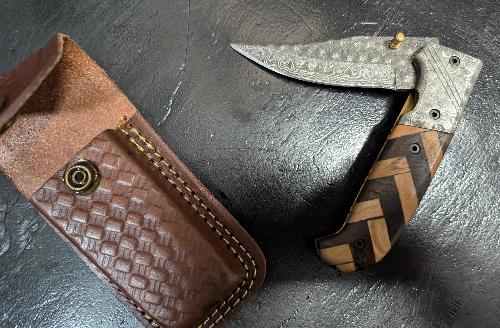 Knife  - Folding pocket style with leather sheath